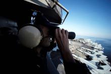 A U.S sailor keeps watch from the captain's bridge onboard the USS John C. Stennis as it makes its way to the Gulf through the Strait of Hormuz, December 21, 2018. PHOTO BY REUTERS/Hamad I Mohammed