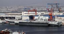 A general view shows navy soldiers standing on China's first aircraft carrier "Liaoning" as it is berthed in a port in Dalian, northeast China's Liaoning province, September 25, 2012. PHOTO BY REUTERS/Stringer