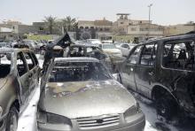 Damaged cars are seen after a car exploded near a Shi'ite mosque in Saudi Arabia's Dammam May 29, 2015. REUTERS/Ali Alhaji