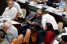 Cuba's former President Raul Castro (C-L) talks to his grandson and bodyguard Raul Rodriguez Castro during a session of the National Assembly in Havana, Cuba, December 21, 2018. PHOTO BY REUTERS/Stringer