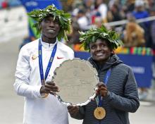 Geoffrey Kamworor and Joyciline Jepkosgei of Kenya, the Men's and Women's champions respectively, pose for a photo after the New York City marathon. PHOTO BY REUTERS/Noah K. Murray-USA TODAY Sports