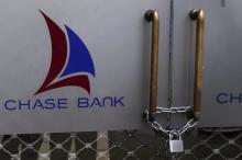 The logo of Chase Bank is seen on the closed entrance of one of its branches, after the bank was put under receivership, in Nairobi, Kenya, April 8, 2016. PHOTO BY REUTERS/Siegfried Modola