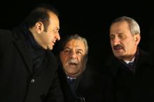 Turkey's European Affairs Minister Egemen Bagis (L), Interior Minister Muammer Guler and Economy Minister Zafer Caglayan (R) chat as they wait for the arrival of Prime Minister Tayyip Erdogan at Esenboga Airport in Ankara