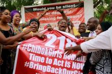 Members of the #BringBackOurGirls (#BBOG) campaign react on the presentation of a banner which shows "218", instead of the previous "219", referring to kidnapped Chibok school girls, during a sit-out in Abuja, Nigeria May 18, 2016. PHOTO BY REUTERS/Afolabi Sotunde
