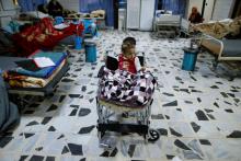 A child who was injured from clashes sits in a wheelchair during receives treatment in the northern Iraqi city of Erbil, Iraq, December 17, 2016. PHOTO BY REUTERS/Ammar Awad