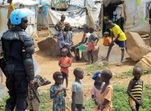 A UN peacekeeper keeps watch as children gather in a camp for displaced civilians in Juba, South Sudan, June 17, 2017. PHOTO BY REUTERS/David Lewis
