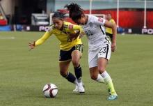 Colombia defender Angela Clavijo (13) and United States forward Christen Press (23) fight for the ball during the second half in the round of sixteen in the FIFA 2015 women's World Cup soccer tournament at Commonwealth Stadium, Edmonton, Alberta, CAN. PHOTO BY USA TODAY Sports/Erich Schlegel
