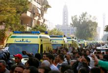 Egyptian Christians shout slogans as ambulances transport the bodies of victims killed in the bombing of Cairo's main Coptic cathedral after the funeral, in Cairo, Egypt, December 12, 2016. PHOTO BY REUTERS/Amr Abdallah Dalsh
