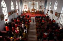 Believers attend a service at the unofficial catholic church in Majhuang village, Hebei Province, China, December 11, 2016. PHOTO BY REUTERS/Thomas Peter