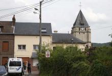 French CRS police secure a street near the church after a hostage-taking in Saint-Etienne-du-Rouvray near Rouen in Normandy, France, July 26, 2016. PHOTO BY REUTERS/Pascal Rossignol