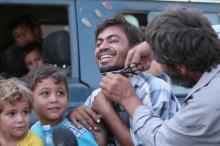 A man cuts the beard of a civilian who was evacuated with others by the Syria Democratic Forces fighters from an Islamic State-controlled neighbourhood of Manbij, in Aleppo Governorate. The SDF has said Islamic State was using civilians as human shields. PHOTO BY REUTERS/Rodi Said