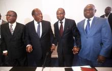 Members of the ruling coalition of RHDP (L-R) Jerome Brou Kablan, Charles Konan Banny, Amara Essy and Kouadio Konan Bertin pose after a news conference in Abidjan, February 26, 2015. PHOTO BY REUTERS/Thierry Gouegnon