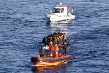 A Turkish Coast Guard fast rigid-hulled inflatable boat tows a dinghy filled with refugees and migrants in the Turkish territorial waters of the North Aegean Sea, following a failed attempt at crossing to the Greek island of Chios, off the shores of Izmir, Turkey, February 28, 2016. PHOTO BY REUTERS/Umit Bektas