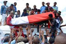 Demonstrators from the opposition carry a casket of a protestor killed last Saturday, after the president denounced unrest in which two people were killed as a "coup" intended to divide the country's people in Antananarivo, Madagascar, April 23, 2018. PHOTO BY REUTERS/Clarel Faniry Rasoanaivo