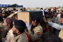 Army soldiers carry the casket of Siraj Raisani, provincial assembly candidate of Baluchistan Awami Party (BAP), who was killed in Friday's suicide attack during an election campaign meeting, for the funeral in Quetta, Pakistan, July 14, 2018. PHOTO BY REUTERS/Naseer Ahmed