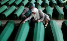 Muslim women cry near coffins of their relatives, who are newly identified victims of the 1995 Srebrenica massacre, which are lined up for a joint burial in Potocari near Srebrenica, Bosnia and Herzegovina, July 9, 2016. PHOTO BY REUTERS/Dado Ruvic