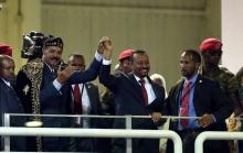 Eritrea's President Isaias Afwerki and Ethiopian Prime Minister Abiy Ahmed hold hands during a concert at the Millennium Hall in Addis Ababa, Ethiopia, July 15, 2018. PHOTO BY REUTERS/Tiksa Negeri