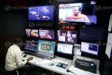 A man sits in a control centre of the NTV channel, which was shutdown by the Kenyan government because of their coverage of opposition leader Raila Odinga's symbolic presidential inauguration this week, at the Nation group media building In Nairobi, Kenya, February 1, 2018. PHOTO BY REUTERS/Baz Ratner