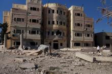 A doctor walks as he inspects the damage, after what activists said were barrel bombs dropped by forces loyal to Syria's President Bashar al-Assad, on a hospital in the city of Nawa, in Deraa province, Syria, November 20, 2015. PHOTO BY REUTERS/Alaa Al-Faqir