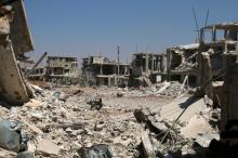 The damaged buildings inside a former Palestinian refugee camp in a rebel-held part of the southern city of Deraa, Syria, June 18, 2017. PHOTO BY REUTERS/Alaa Al-Faqir