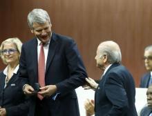 David Gill of England receives his nomination at the Executive Committee from FIFA President Sepp Blatter (R) at the 65th FIFA Congress in Zurich, Switzerland, May 29, 2015. REUTERS/Ruben Sprich