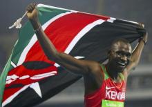 Gold medallist David Lekuta Rudisha (KEN) of Kenya celebrates with flag in Rio de Janeiro, Brazil, August, 2016. REUTERS/Leonhard Foeger
