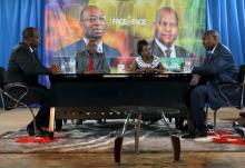Presidential candidates Faustin-Archange Touadera (right) and Anicet-Georges Dologuele (left) face each other during a live television debate ahead of Sunday's second round election, in Bangui, Central African Republic, February 12, 2016. PHOTO BY REUTERS/Siegfried Modola