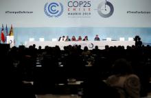 MADRID (Reuters) - Major economies resisted calls for bolder climate commitments as a U.N. summit in Madrid limped toward a delayed conclusion on Saturday, dimming hopes that nations will act in time to stop rising temperatures devastating people and the natural world.  With the two-week gathering spilling into the weekend, campaigners and many delegates slammed Chile, presiding over the talks, for drafting a summit text that they said risked throwing the 2015 Paris Agreement to tackle global warming into r