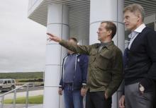 Russia's Prime Minister Dmitry Medvedev (L) speaks with acting Governor of Sakhalin region Oleg Kozhemyako as he visits Iturup Island, one of four islands known as the Southern Kurils in Russia and the Northern Territories in Japan, August 22, 2015. PHOTO BY REUTERS/Dmitry Astakhov