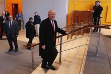 U.S. President elect Donald Trump walks up a staircase to depart the lobby of the New York Times building after a meeting in New York, U.S., November 22, 2016. PHOTO BY REUTERS/Lucas Jackson