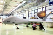 Employees check an Elbit Systems Ltd. Hermes 900 unmanned aerial vehicle (UAV) at the company's drone factory in Rehovot, Israel, June 28, 2018. PHOTO BY REUTERS/Orel Cohen