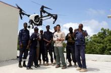 Somali police officers watch instructor Brett Velicovich fly a DJI Inspire drone during a drone training session for Somali police in Mogadishu, Somalia, May 25, 2017. PHOTO BY REUTERS/Feisal Omar