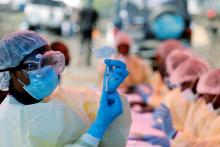 A health worker fills a syringe with Ebola vaccine before injecting it to a patient, in Goma, Democratic Republic of Congo, August 5, 2019. PHOTO BY REUTERS/Baz Ratner