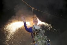 Mexicans burn an effigy of U.S. Republican presidential hopeful Donald Trump as they celebrate an Easter ritual late on Saturday in Mexico City's poor La Merced neighborhood March 26, 2016. REUTERS/Henry Romero
