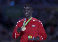 Eliud Kipchoge (KEN) of Kenya poses with his gold medal in the Men's Marathon Victory Ceremony at Maracana Stadium in Rio de Janeiro, Brazil, August, 21, 2016. PHOTO BY  REUTERS/Stoyan Nenov