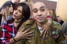 Israeli soldier Elor Azaria is embraced by his mother at the start of is sentencing hearing at a military court in Tel Aviv, Israel, February 21, 2017. PHOTO BY REUTERS/Jim Hollander