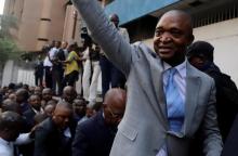 Former Congolese interior minister Emmanuel Ramazani Shadary waves to his supporters at the Congo's electoral commission (CENI) head offices at the Gombe Municipality in Kinshasa, Democratic Republic of Congo, August 8, 2018. PHOTO BY REUTERS/Kenny Katombe