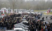 Germanwings employees gather outside the company headquarters to observe a minute of silence in Cologne Bonn airport, March 25, 2015. PHOTO BY REUTERS/Wolfgang Rattay