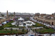 People walk at Erbil fountain square as seen from the Citadel, Iraq, April 14, 2017. PHOTO BY REUTERS/Jamal Saidi