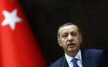 Turkey's Prime Minister Tayyip Erdogan addresses members of parliament from his ruling AK Party (AKP) during a meeting at the Turkish parliament in Ankara