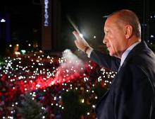 Turkish President Tayyip Erdogan greets his supporters from the balcony of his ruling AK Party headquarters in Ankara, Turkey, early June 25, 2018. PHOTO BY REUTERS/Kayhan Ozer/Presidential Palace