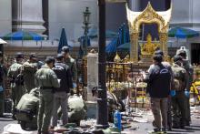 Experts investigate the Erawan shrine at the site of a deadly blast in central Bangkok, Thailand, August 18, 2015. PHOTO BY REUTERS/Athit Perawongmetha