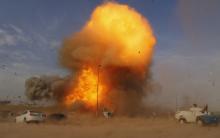 An explosion during a car bomb attack at a rally held by Shi'ite political organisation Asaib Ahl Haq (League of the Righteous) in Baghdad, April 25, 2014. PHOTO BY REUTERS/Thaier Al-Sudani