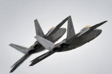 Two F-22 Raptor fighter jets from the 3rd Wing at Joint Base Elmendorf-Richardson, Alaska, conduct approach training, March 24, 2016. PHOTO BY REUTERS/Justin Connaher