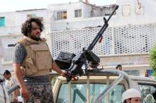 A fighter of the southern Yemeni separatists mans a machine gun mounted on a military vehicle securing an anti-government protest in Aden, Yemen, January 28, 2018. PHOTO BY REUTERS/Fawaz Salman