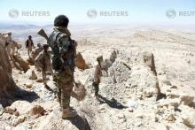 Yemeni soldiers stand on their position on a mountain on the frontline of fighting with Houthis in Nihem area, near Sanaa, Yemen, January 27, 2018. PHOTO BY REUTERS/Faisal Al Nasser