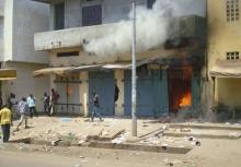 Fire breaks out in a store during clashes between rival gangs in Marche Madina, in Conakry March 1, 2013 in this file photo. PHOTO BY REUTERS/Saliou Samb