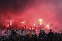 Police officers react as chaos erupts at a soccer stadium in Port Said city, Egypt, February 1, 2012. PHOTO BY REUTERS/Stringer