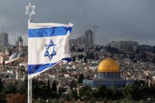 An Israeli flag is seen near the Dome of the Rock, located in Jerusalem's Old City on the compound known to Muslims as Noble Sanctuary and to Jews as Temple Mount, December 6, 2017. PHOTO BY REUTERS/Ammar Awad