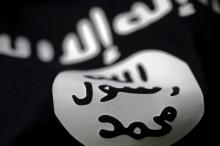 An Islamic State flag is seen in this picture illustration taken February 18, 2016. PHOTO BY REUTERS/Dado Ruvic/Illustration